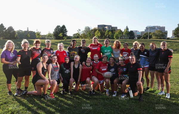 250822 - Wales Women Rugby Community Engagement in Canada - Wales’ players with Halifax RFC Junior Girls during a training session in Halifax, Canada