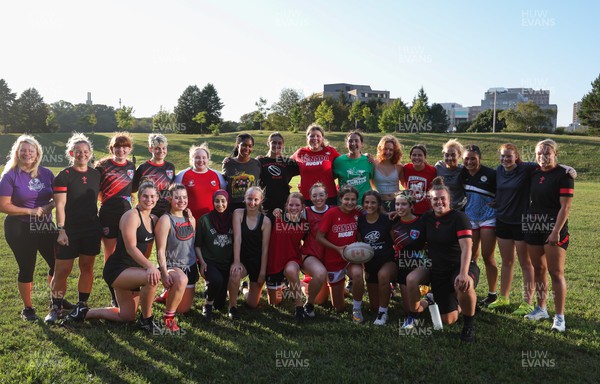 250822 - Wales Women Rugby Community Engagement in Canada - Wales’ players with Halifax RFC Junior Girls during a training session in Halifax, Canada