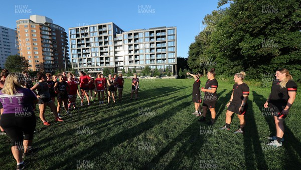 250822 - Wales Women Rugby Community Engagement in Canada - Wales’ Keira Bevan, Carys Phillips, Kerin Lake, and Gwen Crabb chat with Halifax RFC Junior Girls during a training session in Halifax, Canada