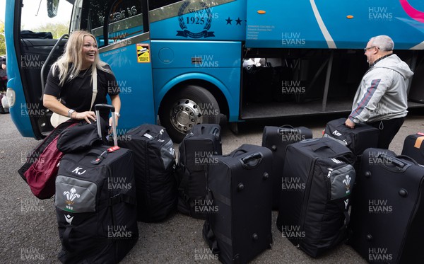 101023 - Wales Women Rugby team depart for WXV1 - Kelsey Jones adds her luggage to the rest of the team’s as they prepare to depart the National Centre of Excellence at the Vale for WXV1 in New Zealand