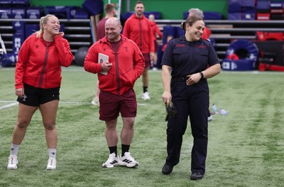 040526 - Wales Women Rugby with South Wales Fire Service - Wales International Squad member and South Wales Fire Service fire fighter Jenni Scoble brings her colleagues from Blue Watch Roath to meet and take part in team building with her Wales team members Jenni Scoble shares a joke with Kelsey Jones and Sean Lynn, Wales Women head coach