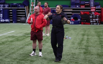 040526 - Wales Women Rugby with South Wales Fire Service - Wales International Squad member and South Wales Fire Service fire fighter Jenni Scoble brings her colleagues from Blue Watch Roath to meet and take part in team building with her Wales team members Jenni Scoble shares a joke with Kelsey Jones and Sean Lynn, Wales Women head coach