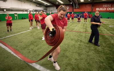 040526 - Wales Women Rugby with South Wales Fire Service - Wales International Squad member and South Wales Fire Service fire fighter Jenni Scoble brings her colleagues from Blue Watch Roath to meet and take part in team building with her Wales team members Gwenllian Pyrs takes part in the team exercise