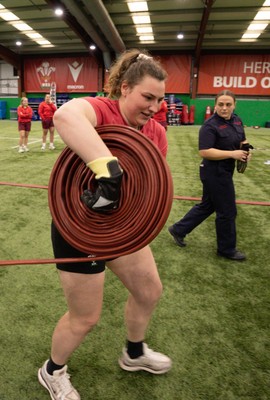 040526 - Wales Women Rugby with South Wales Fire Service - Wales International Squad member and South Wales Fire Service fire fighter Jenni Scoble brings her colleagues from Blue Watch Roath to meet and take part in team building with her Wales team members Gwenllian Pyrs takes part in the team exercise