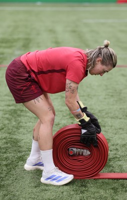 040526 - Wales Women Rugby with South Wales Fire Service - Wales International Squad member and South Wales Fire Service fire fighter Jenni Scoble brings her colleagues from Blue Watch Roath to meet and take part in team building with her Wales team members Keira Bevan during a team challenge
