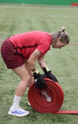 040526 - Wales Women Rugby with South Wales Fire Service - Wales International Squad member and South Wales Fire Service fire fighter Jenni Scoble brings her colleagues from Blue Watch Roath to meet and take part in team building with her Wales team members Keira Bevan during a team challenge