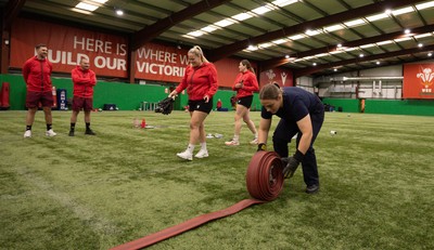 040526 - Wales Women Rugby with South Wales Fire Service - Wales International Squad member and South Wales Fire Service fire fighter Jenni Scoble brings her colleagues from Blue Watch Roath to meet and take part in team building with her Wales team members Jenna De Vera is watched by her team mates