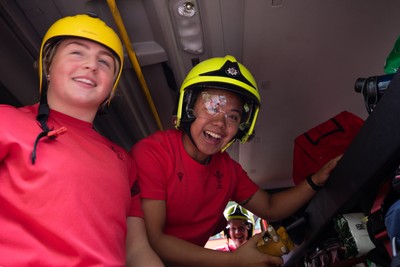 040526 - Wales Women Rugby with South Wales Fire Service - Wales International Squad member and South Wales Fire Service fire fighter Jenni Scoble brings her colleagues from Blue Watch Roath to meet and take part in team building with her Wales team members Molly Reardon and Jenna De Vera in the fire engine