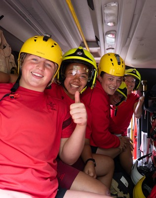 040526 - Wales Women Rugby with South Wales Fire Service - Wales International Squad member and South Wales Fire Service fire fighter Jenni Scoble brings her colleagues from Blue Watch Roath to meet and take part in team building with her Wales team members Molly Reardon, Jenna De Vera, Alisha Joyce, Tilly Vucaj and Carys Cox in the fire engine