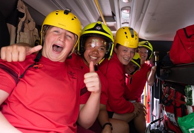 040526 - Wales Women Rugby with South Wales Fire Service - Wales International Squad member and South Wales Fire Service fire fighter Jenni Scoble brings her colleagues from Blue Watch Roath to meet and take part in team building with her Wales team members Molly Reardon, Jenna De Vera, Alisha Joyce, Tilly Vucaj and Carys Cox in the fire engine