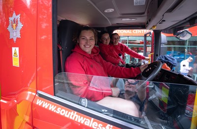 040526 - Wales Women Rugby with South Wales Fire Service - Wales International Squad member and South Wales Fire Service fire fighter Jenni Scoble brings her colleagues from Blue Watch Roath to meet and take part in team building with her Wales team members Gwenllian Pyrs at the wheel of the fire engine with Jorja Aiono and Branwen Metcalfe