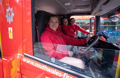 040526 - Wales Women Rugby with South Wales Fire Service - Wales International Squad member and South Wales Fire Service fire fighter Jenni Scoble brings her colleagues from Blue Watch Roath to meet and take part in team building with her Wales team members Gwenllian Pyrs at the wheel of the fire engine with Jorja Aiono and Branwen Metcalfe