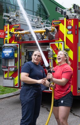 040526 - Wales Women Rugby with South Wales Fire Service - Wales International Squad member and South Wales Fire Service fire fighter Jenni Scoble brings her colleagues from Blue Watch Roath to meet and take part in team building with her Wales team members Jenni Scoble explains the hose operation to Molly Reardon