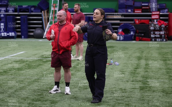040526 - Wales Women Rugby with South Wales Fire Service - Wales International Squad member and South Wales Fire Service fire fighter Jenni Scoble brings her colleagues from Blue Watch Roath to meet and take part in team building with her Wales team members Jenni Scoble shares a joke with Kelsey Jones and Sean Lynn, Wales Women head coach
