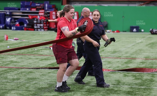 040526 - Wales Women Rugby with South Wales Fire Service - Wales International Squad member and South Wales Fire Service fire fighter Jenni Scoble brings her colleagues from Blue Watch Roath to meet and take part in team building with her Wales team members Jenni Scoble works with Maisie Davies during a team challenge