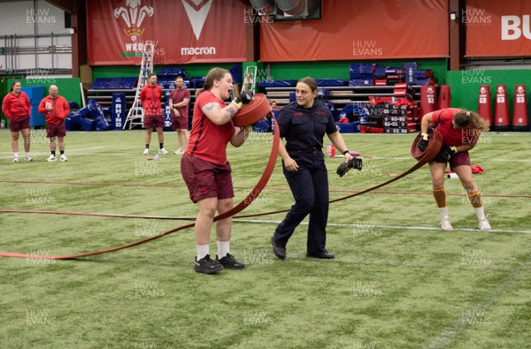 040526 - Wales Women Rugby with South Wales Fire Service - Wales International Squad member and South Wales Fire Service fire fighter Jenni Scoble brings her colleagues from Blue Watch Roath to meet and take part in team building with her Wales team members Jenni Scoble with team mate Maisie Davies during the team challenge
