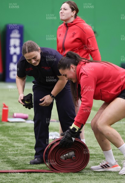 040526 - Wales Women Rugby with South Wales Fire Service - Wales International Squad member and South Wales Fire Service fire fighter Jenni Scoble brings her colleagues from Blue Watch Roath to meet and take part in team building with her Wales team members Jenni Scoble works with Jorja Aiono during a team challenge