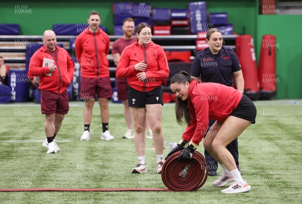 040526 - Wales Women Rugby with South Wales Fire Service - Wales International Squad member and South Wales Fire Service fire fighter Jenni Scoble brings her colleagues from Blue Watch Roath to meet and take part in team building with her Wales team members Jenni Scoble works with Jorja Aiono during a team challenge