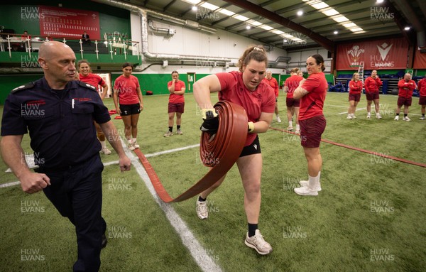 040526 - Wales Women Rugby with South Wales Fire Service - Wales International Squad member and South Wales Fire Service fire fighter Jenni Scoble brings her colleagues from Blue Watch Roath to meet and take part in team building with her Wales team members Gwenllian Pyrs takes part in the team exercise