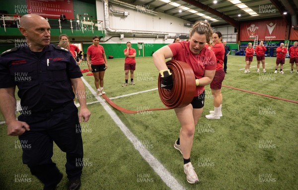 040526 - Wales Women Rugby with South Wales Fire Service - Wales International Squad member and South Wales Fire Service fire fighter Jenni Scoble brings her colleagues from Blue Watch Roath to meet and take part in team building with her Wales team members Gwenllian Pyrs takes part in the team exercise