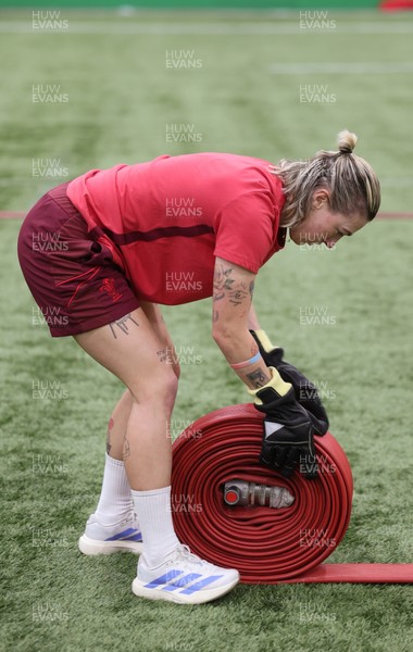 040526 - Wales Women Rugby with South Wales Fire Service - Wales International Squad member and South Wales Fire Service fire fighter Jenni Scoble brings her colleagues from Blue Watch Roath to meet and take part in team building with her Wales team members Keira Bevan during a team challenge