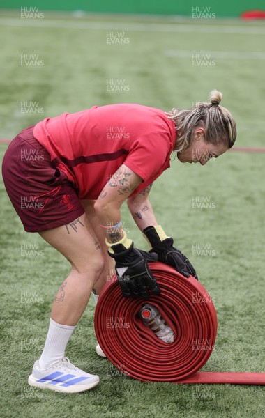 040526 - Wales Women Rugby with South Wales Fire Service - Wales International Squad member and South Wales Fire Service fire fighter Jenni Scoble brings her colleagues from Blue Watch Roath to meet and take part in team building with her Wales team members Keira Bevan during a team challenge
