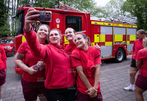 040526 - Wales Women Rugby with South Wales Fire Service - Wales International Squad member and South Wales Fire Service fire fighter Jenni Scoble brings her colleagues from Blue Watch Roath to meet and take part in team building with her Wales team members Maisie Davies, Gwenllian Pyrs, Carys Cox and Jasmine Joyce with the fire engine