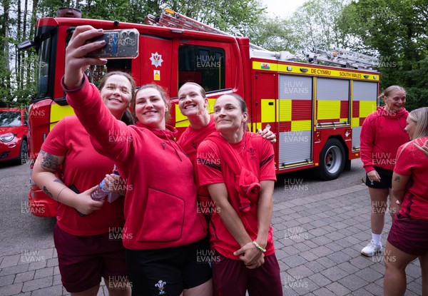 040526 - Wales Women Rugby with South Wales Fire Service - Wales International Squad member and South Wales Fire Service fire fighter Jenni Scoble brings her colleagues from Blue Watch Roath to meet and take part in team building with her Wales team members Maisie Davies, Gwenllian Pyrs, Carys Cox and Jasmine Joyce with the fire engine