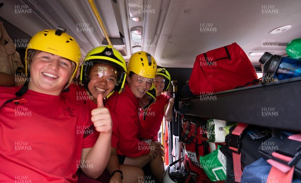 040526 - Wales Women Rugby with South Wales Fire Service - Wales International Squad member and South Wales Fire Service fire fighter Jenni Scoble brings her colleagues from Blue Watch Roath to meet and take part in team building with her Wales team members Molly Reardon, Jenna De Vera, Alisha Joyce, Tilly Vucaj and Carys Cox in the fire engine