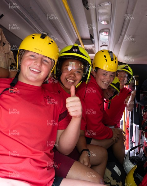 040526 - Wales Women Rugby with South Wales Fire Service - Wales International Squad member and South Wales Fire Service fire fighter Jenni Scoble brings her colleagues from Blue Watch Roath to meet and take part in team building with her Wales team members Molly Reardon, Jenna De Vera, Alisha Joyce, Tilly Vucaj and Carys Cox in the fire engine