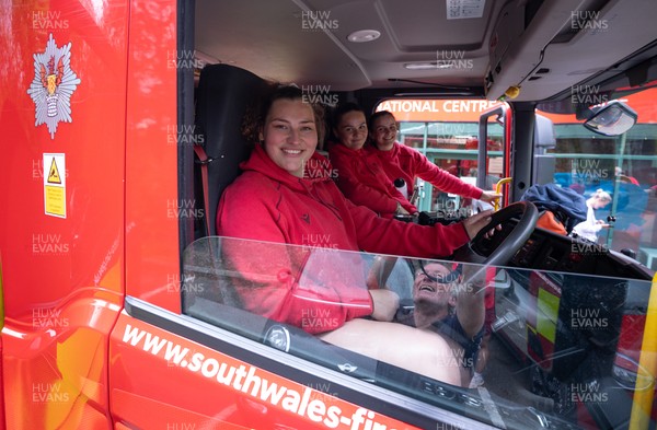 040526 - Wales Women Rugby with South Wales Fire Service - Wales International Squad member and South Wales Fire Service fire fighter Jenni Scoble brings her colleagues from Blue Watch Roath to meet and take part in team building with her Wales team members Gwenllian Pyrs at the wheel of the fire engine with Jorja Aiono and Branwen Metcalfe
