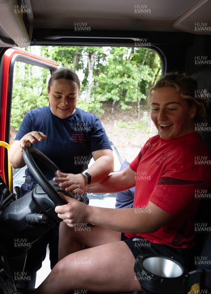 040526 - Wales Women Rugby with South Wales Fire Service - Wales International Squad member and South Wales Fire Service fire fighter Jenni Scoble brings her colleagues from Blue Watch Roath to meet and take part in team building with her Wales team members Molly Reardon gets to take the drivers seat as Jenni Scoble looks on