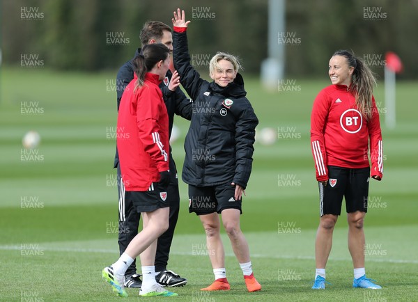 060421 Wales Women Football Training Session - Jess Fishlock, centre, with Helen Ward, left and Natasha Harding during training session ahead of their match against Canada