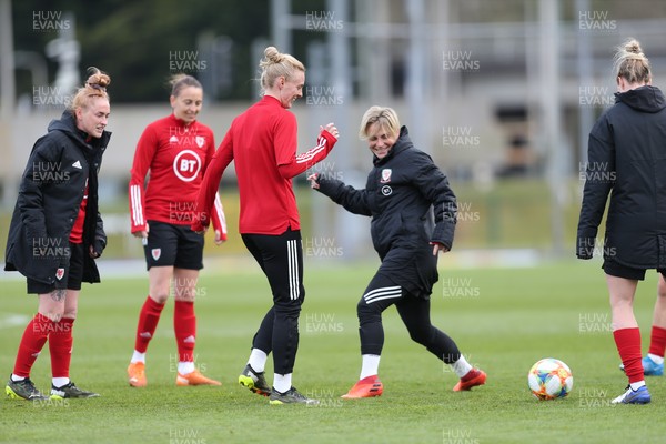 080421 Wales Women Football Training Session - Sophie Ingle, centre is challenged by Jess Fishlock during a training session at Leckwith Stadium ahead of their match against Canada