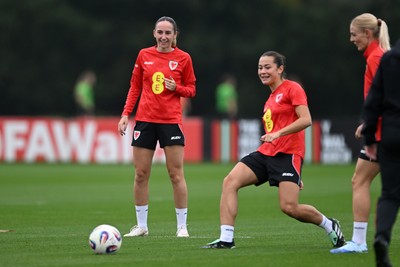 121026 - Wales Women Football Training - Olivia Francis and Scarlett Hill during training head of their sides World Cup play-off match against Albania