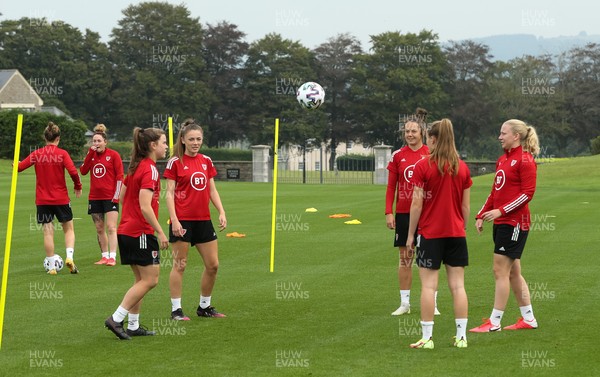 140921 - Wales Women Football Training Session - Members of the Wales Women's football squad warm up during a training session ahead of their opening 2023 FIFA Women’s World Cup Qualifying Round matches against Kazakhstan and Estonia