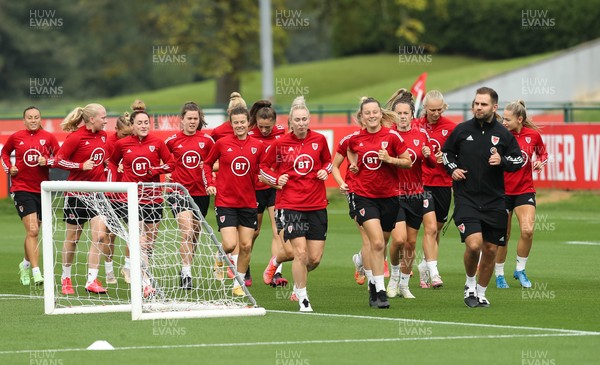 140921 - Wales Women Football Training Session - Members of the Wales Women's football squad warm up during a training session ahead of their opening 2023 FIFA Women’s World Cup Qualifying Round matches against Kazakhstan and Estonia