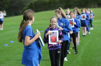 160921 - Wales Women Football Training Session - Pupils from Dolau Primary School, Llanharan, wait to make a surprise welcome for the members of the Wales Womens Football team, and pass on letters they have written to them, ahead of the team's opening 2023 FIFA Women’s World Cup Qualifying Round matches against Kazakhstan and Estonia