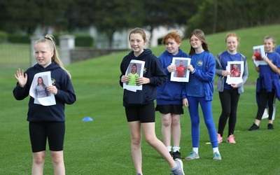 160921 - Wales Women Football Training Session - Pupils from Dolau Primary School, Llanharan, wait to make a surprise welcome for the members of the Wales Womens Football team, and pass on letters they have written to them, ahead of the team's opening 2023 FIFA Women’s World Cup Qualifying Round matches against Kazakhstan and Estonia