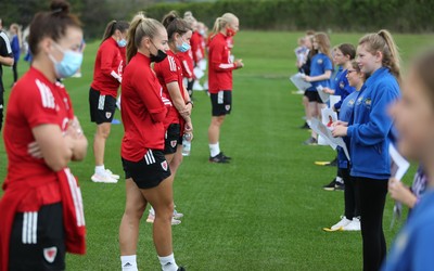 160921 - Wales Women Football Training Session - Pupils from Dolau Primary School, Llanharan, talk to members of the Wales Women's Football team after the pupils made a surprise visit to meet the team, and pass on letters they have written to them, ahead of the team's opening 2023 FIFA Women’s World Cup Qualifying Round matches against Kazakhstan and Estonia