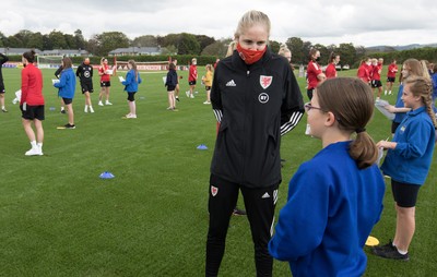 160921 - Wales Women Football Training Session - Pupils from Dolau Primary School, Llanharan, wait to make a surprise welcome for the members of the Wales Womens Football team, and pass on letters they have written to them, ahead of the team's opening 2023 FIFA Women’s World Cup Qualifying Round matches against Kazakhstan and Estonia