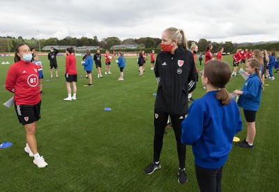 160921 - Wales Women Football Training Session - Pupils from Dolau Primary School, Llanharan, wait to make a surprise welcome for the members of the Wales Womens Football team, and pass on letters they have written to them, ahead of the team's opening 2023 FIFA Women’s World Cup Qualifying Round matches against Kazakhstan and Estonia