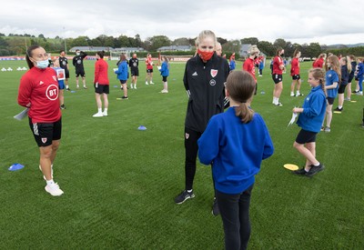 160921 - Wales Women Football Training Session - Pupils from Dolau Primary School, Llanharan, wait to make a surprise welcome for the members of the Wales Womens Football team, and pass on letters they have written to them, ahead of the team's opening 2023 FIFA Women’s World Cup Qualifying Round matches against Kazakhstan and Estonia