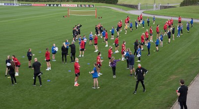 160921 - Wales Women Football Training Session - Pupils from Dolau Primary School, Llanharan, with members of the Wales Womens Football team, after the pupils met the players to show their support and pass on letters they have written to them, ahead of the team's opening 2023 FIFA Women’s World Cup Qualifying Round matches against Kazakhstan and Estonia