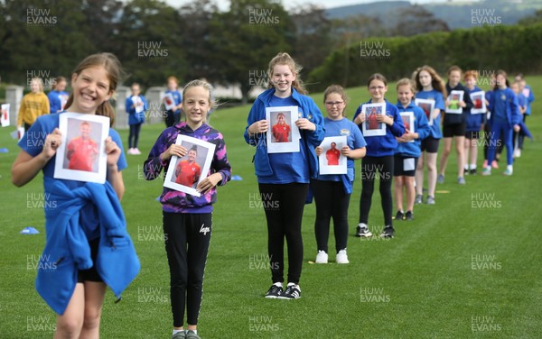 160921 - Wales Women Football Training Session - Pupils from Dolau Primary School, Llanharan, wait to make a surprise welcome for the members of the Wales Womens Football team, and pass on letters they have written to them, ahead of the team's opening 2023 FIFA Women’s World Cup Qualifying Round matches against Kazakhstan and Estonia