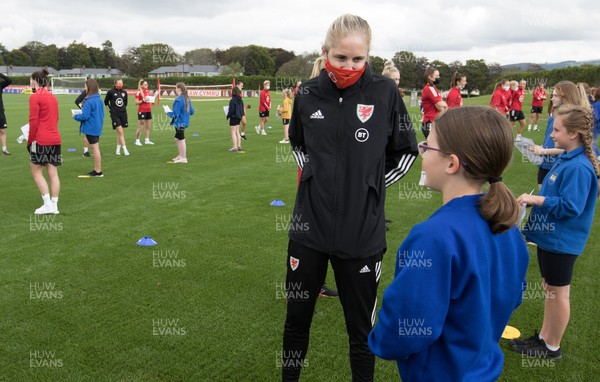 160921 - Wales Women Football Training Session - Pupils from Dolau Primary School, Llanharan, wait to make a surprise welcome for the members of the Wales Womens Football team, and pass on letters they have written to them, ahead of the team's opening 2023 FIFA Women’s World Cup Qualifying Round matches against Kazakhstan and Estonia