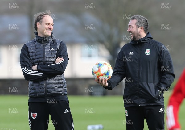 170221 - Wales Women Football Training Session - Interim coach David Adams, left, and interim assistant coach Matty Jones during the squad warm up at a training session, the first since the departure of Jayne Ludlow as Wales national team manager