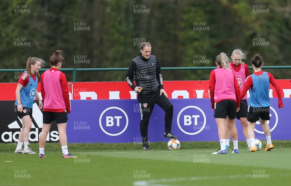 170221 - Wales Women Football Training Session - Interim coach David Adams takes a group through a skills session during Wales Women's Football squad training