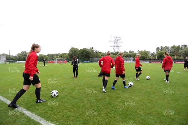 280818 - Wales Women Football Training - Players walk out onto the training pitch