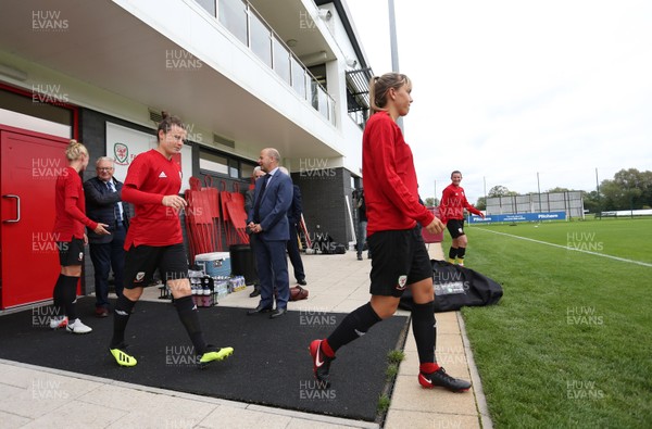 280818 - Wales Women Football Training - Players walk out onto the training pitch
